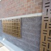 Revamp Panels Cross Hatch pattern metal privacy screen bank architecture remodel commercial close up